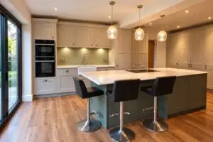 In-frame Belgravia kitchen in Willow and Stone with painted island